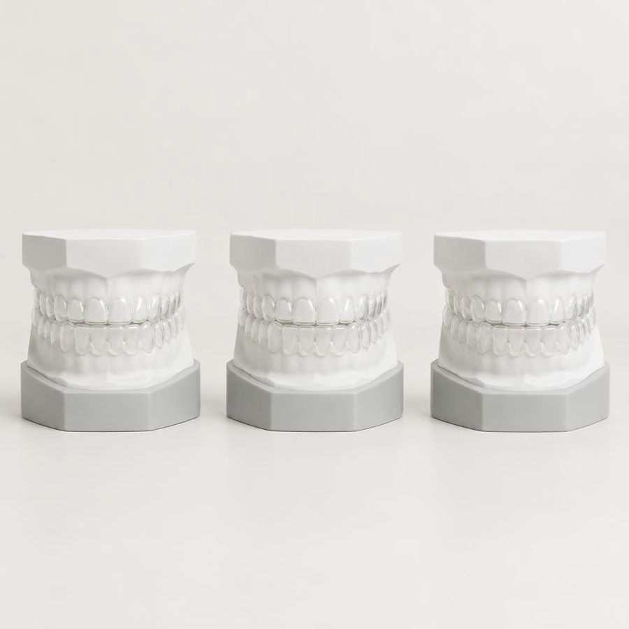 Consistency — Planet Ortho International Three identical orthodontic models in a controlled row